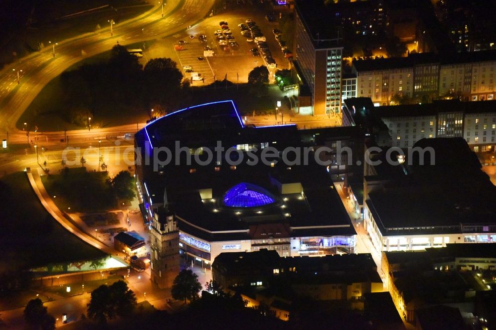 Aerial photograph at night Rostock - Night lighting Building of the shopping center Kroepeliner Tor Center in Rostock in the state Mecklenburg - Western Pomerania, Germany