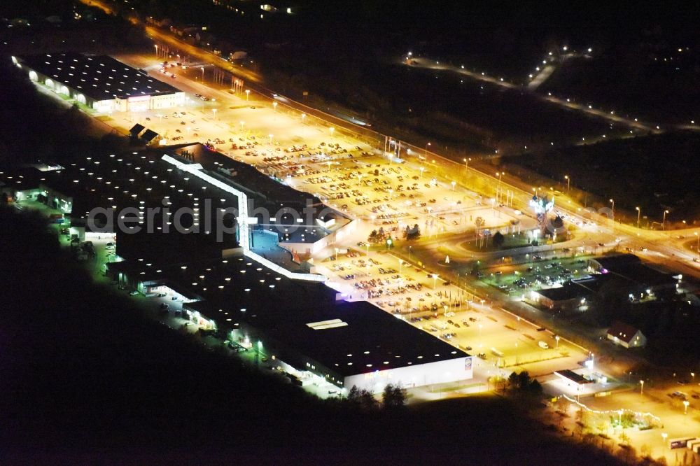 Aerial photograph at night Rostock - Night view building of the shopping center Ostsee Park Rostock in the district Sievershagen in Lambrechtshagen in the state Mecklenburg - Western Pomerania