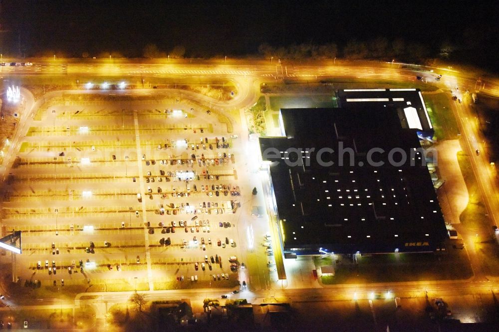 Aerial photograph at night Rostock - Night view building of the store - furniture market in Rostock im Bundesland Mecklenburg-Vorpommern in the district Ortsamt 4 in Rostock in the state Mecklenburg - Western Pomerania