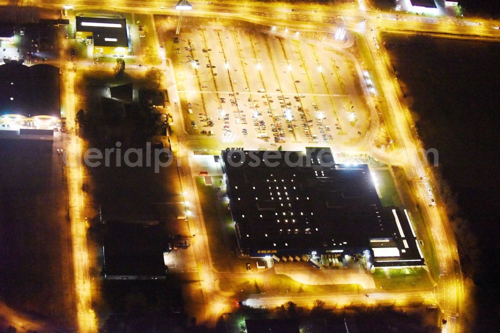 Rostock at night from above - Night view building of the store - furniture market in Rostock im Bundesland Mecklenburg-Vorpommern in the district Ortsamt 4 in Rostock in the state Mecklenburg - Western Pomerania