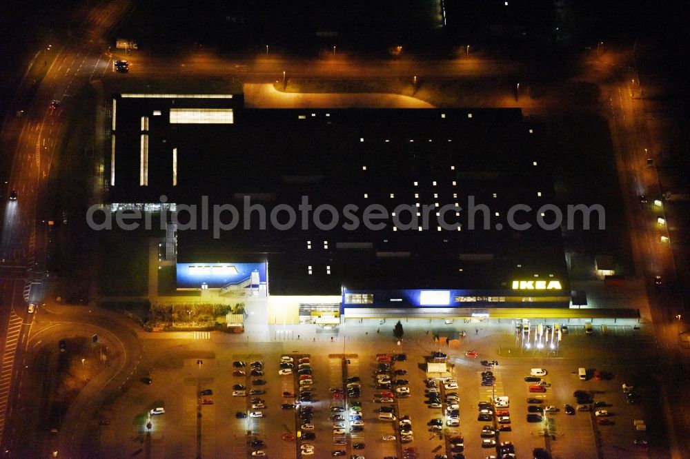 Aerial photograph at night Rostock - Night view building of the store - furniture market in Rostock im Bundesland Mecklenburg-Vorpommern in the district Ortsamt 4 in Rostock in the state Mecklenburg - Western Pomerania