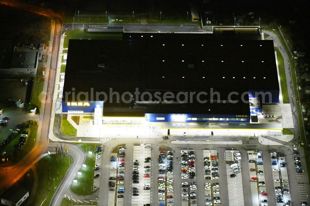 Aerial photograph at night Magdeburg - Night lighting building of the store - furniture market IKEA Magdeburg on Ebendorfer Chaussee in the district Kannenstieg in Magdeburg in the state Saxony-Anhalt, Germany