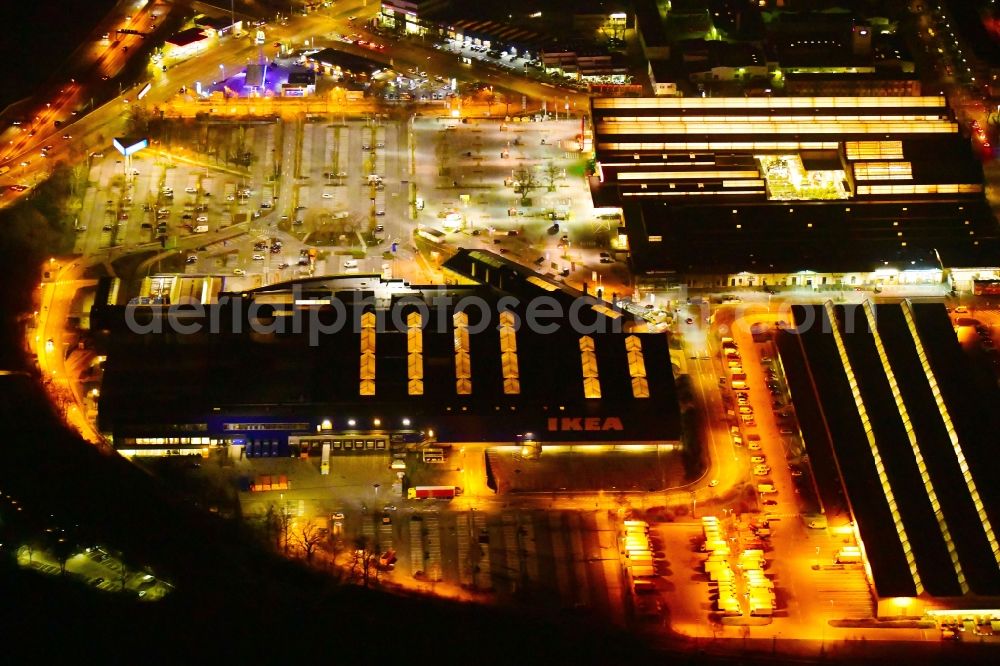 Berlin at night from the bird perspective: Night lighting building of the store - furniture market IKEA Moebel & Einrichtungshaus Berlin-Tempelhof on Sachsendonm in the district Tempelhof in Berlin, Germany