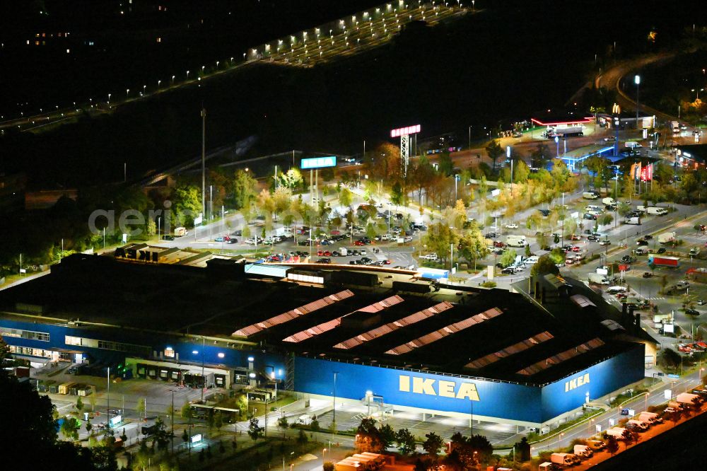 Berlin at night from the bird perspective: Night lighting building of the store - furniture market IKEA Moebel & Einrichtungshaus Berlin-Tempelhof on Sachsendonm in the district Tempelhof in Berlin, Germany