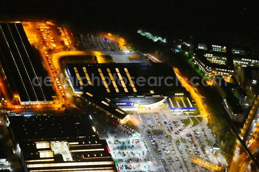 Berlin at night from the bird perspective: Night lighting Building of the store - furniture market IKEA Moebel & Einrichtungshaus Berlin-Tempelhof on Sachsendonm in the district Tempelhof-Schoeneberg in Berlin, Germany