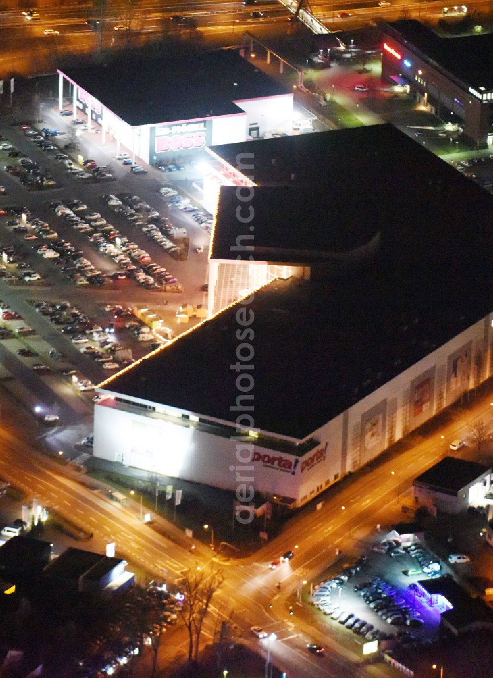 Aerial image at night Potsdam - Night lighting Night view Building of the store - furniture market Porta Moebel in Potsdam in the state Brandenburg