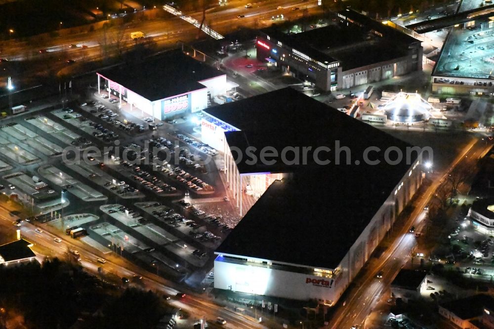 Potsdam at night from the bird perspective: Night view Building of the store - furniture market Porta Moebel in Potsdam in the state Brandenburg