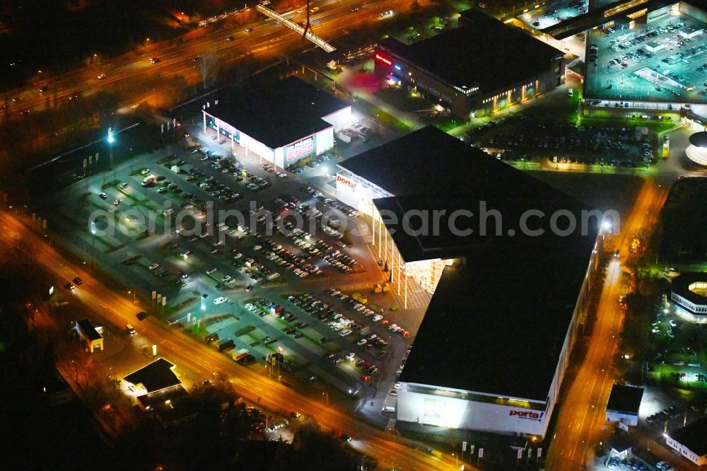 Aerial image at night Potsdam - Night view Building of the store - furniture market Porta Moebel in Potsdam in the state Brandenburg