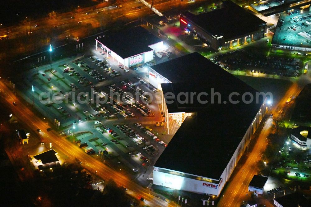 Potsdam at night from the bird perspective: Night view Building of the store - furniture market Porta Moebel in Potsdam in the state Brandenburg