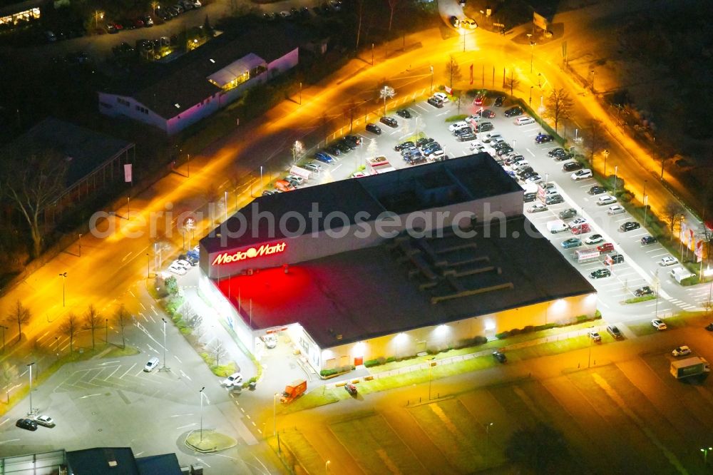 Düsseldorf at night from above - Night lighting building of the electronics store Media Markt in Duesseldorf in the state of North Rhine-Westphalia