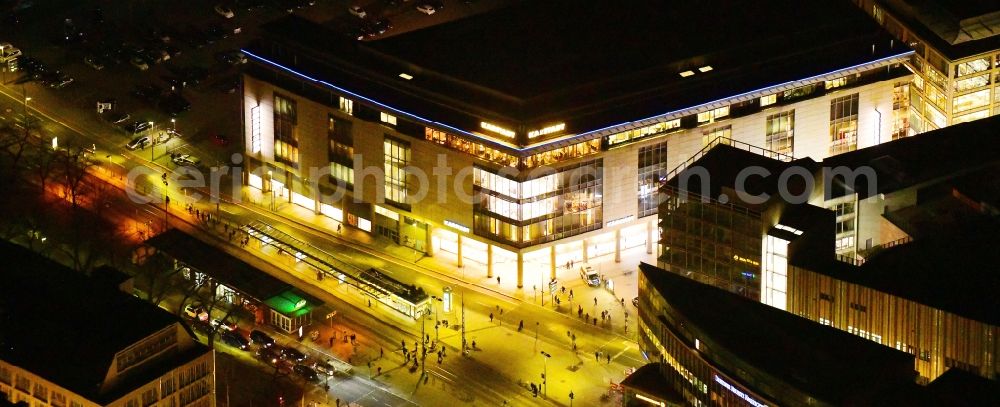 Aerial image at night Dresden - Night lighting building of the department store Karstadt Dresden in der Prager Strasse in Dresden in the state Saxony