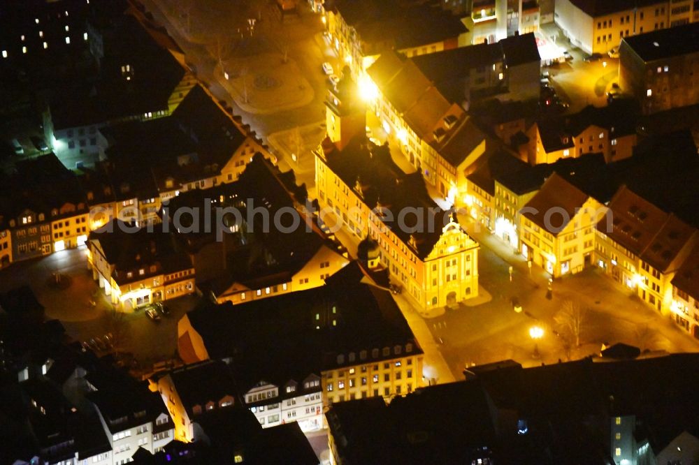 Aerial image at night Gotha - Night lighting Town Hall building of the City Council at the market downtown in Gotha in the state Thuringia, Germany