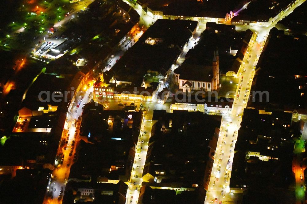 Aerial photograph at night Kyritz - Night lighting Town Hall building of the City Council at the market downtown in Kyritz in the state Brandenburg, Germany