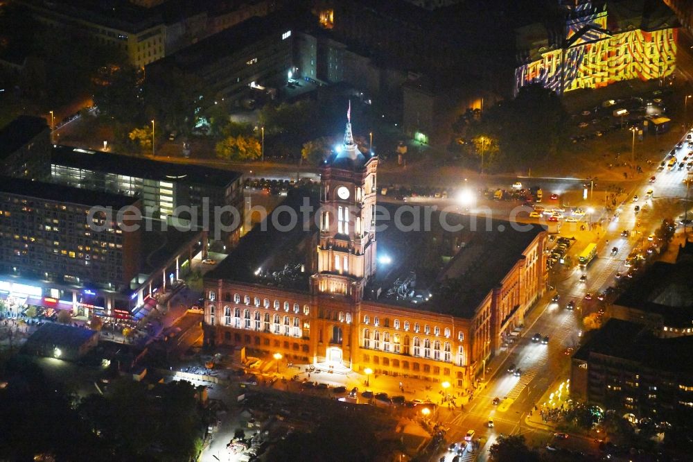 Aerial photograph at night Berlin - Night lighting Town Hall building of the city administration Rotes Rathaus on Rathausstrasse in the district Mitte in Berlin, Germany