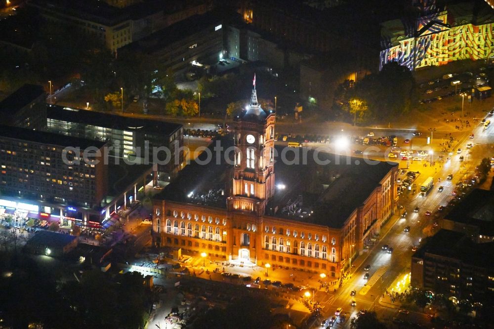 Aerial image at night Berlin - Night lighting Town Hall building of the city administration Rotes Rathaus on Rathausstrasse in the district Mitte in Berlin, Germany