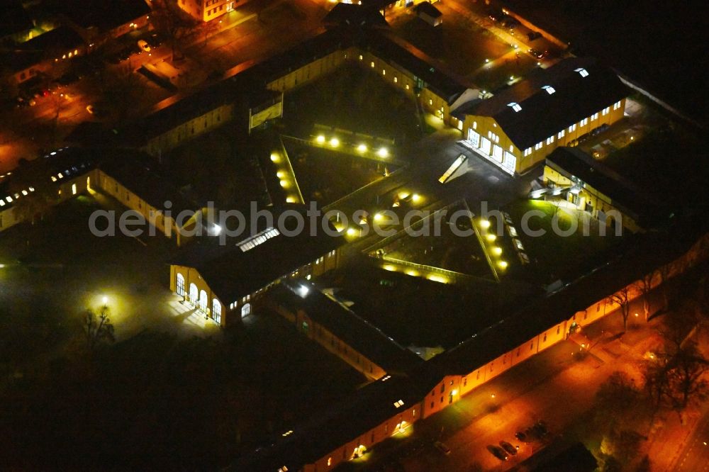 Aerial image at night Potsdam - Night lighting Building complex of the former military barracks Garde-Ulanen-Kaserne in of Jaegerallee in Potsdam in the state Brandenburg, Germany