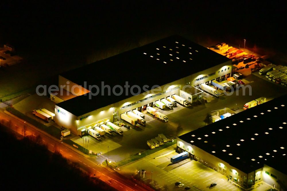 Wustermark at night from above - Night lighting building complex and grounds of the logistics center Havi Logistics in Wustermark in the state Brandenburg, Germany