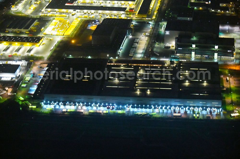 Hamburg at night from above - Night lighting building complex and grounds of the logistics center of H&M Hennes & Mauritz Logistik AB & Co. KG on Rungedonm in Hamburg, Germany