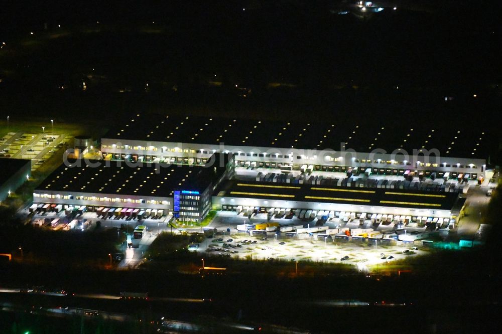 Hamburg at night from above - Night lighting building complex and grounds of the logistics center of Kuehne + Nagel KG Beim Schroeofschen Hof in Hamburg, Germany