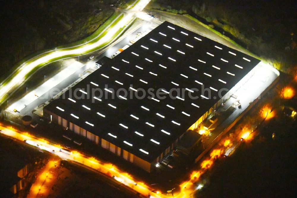 Ludwigsfelde at night from above - Night lighting Building complex and grounds of the logistics center LIDL on Parkallee corner Ludwigsfelder Strasse in the district Genshagen in Ludwigsfelde in the state Brandenburg, Germany