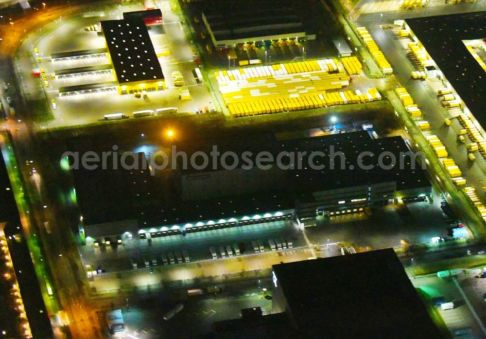 Hamburg at night from above - Night lighting building complex and grounds of the logistics center Logistikzentrum IWAN BUDNIKOWSKY GmbH & Co. KG on Hermann-Wuesthof-Ring in the district Allermoehe in Hamburg, Germany