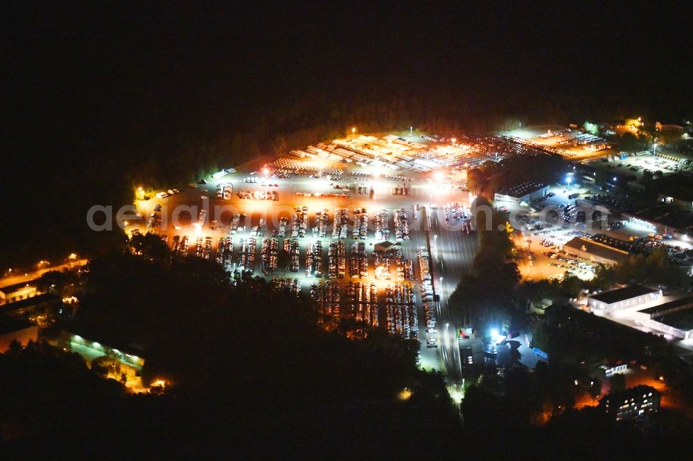 Aerial photograph at night Neuseddin - Night lighting building complex and grounds of the logistics center of Werner Egerland Automobillogistik GmbH & Co. KG in Neuseddin in the state Brandenburg, Germany