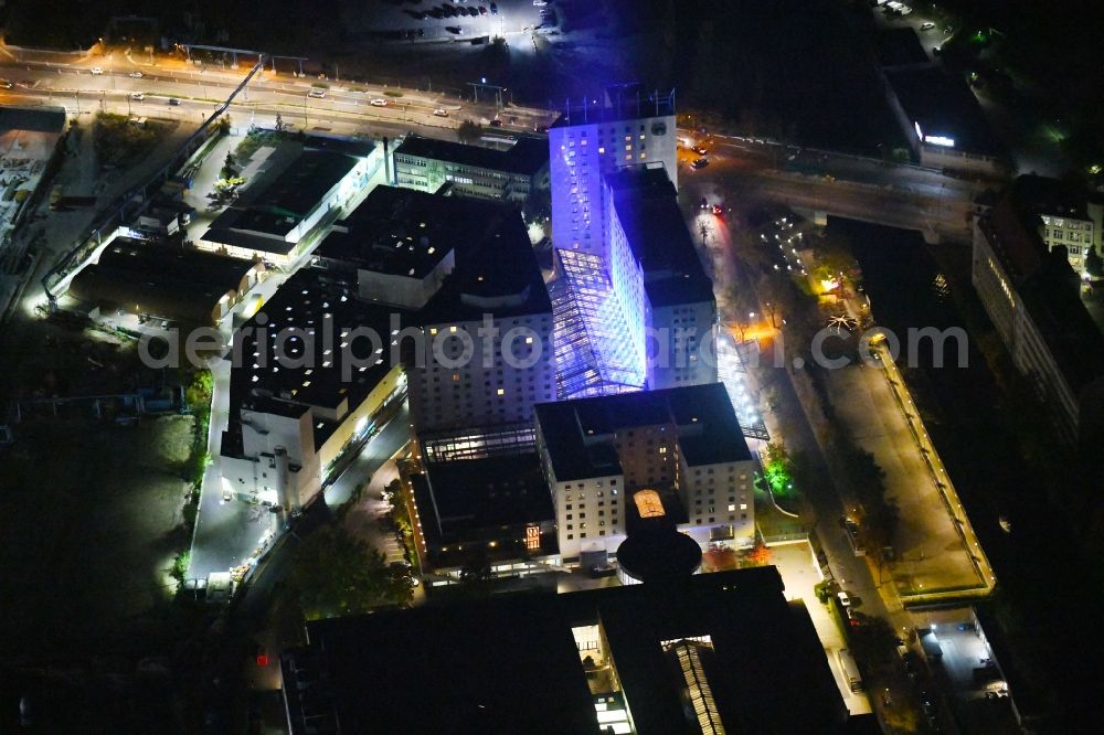 Berlin at night from above - Night lighting Complex of the hotel building Estrel Berlin in the district Neukoelln in Berlin, Germany