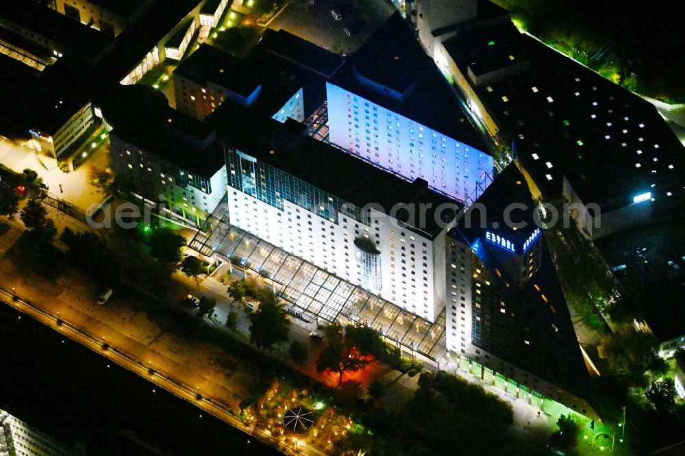 Aerial photograph at night Berlin - Night lighting Complex of the hotel building Estrel Berlin in the district Neukoelln in Berlin, Germany