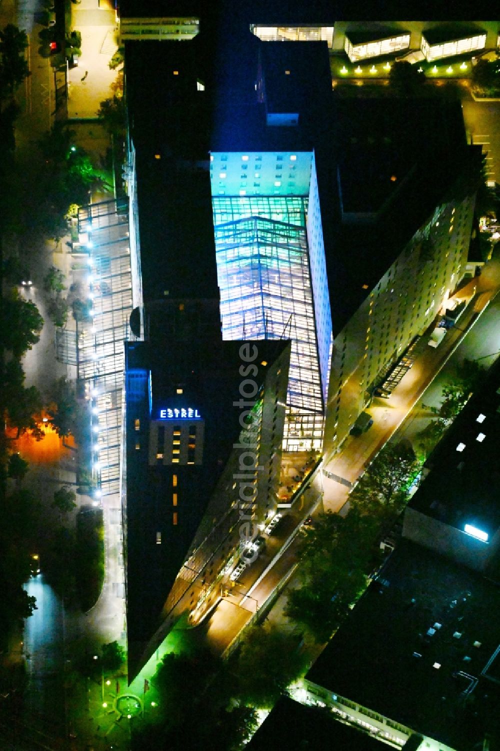 Berlin at night from above - Night lighting Complex of the hotel building Estrel Berlin in the district Neukoelln in Berlin, Germany