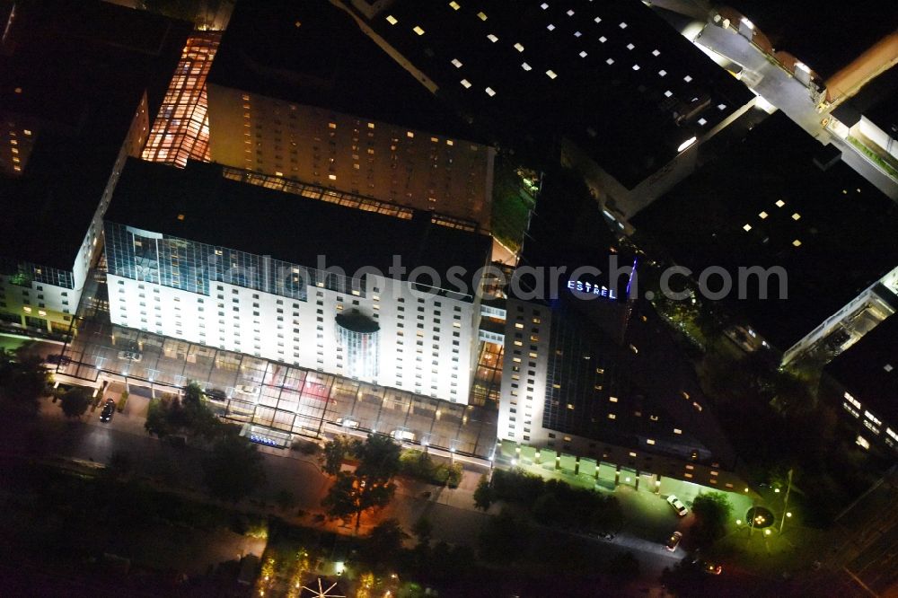 Berlin at night from the bird perspective: Night view complex of the hotel building Estrel on Sonnenallee destrict im Neukoelln in Berlin in Germany