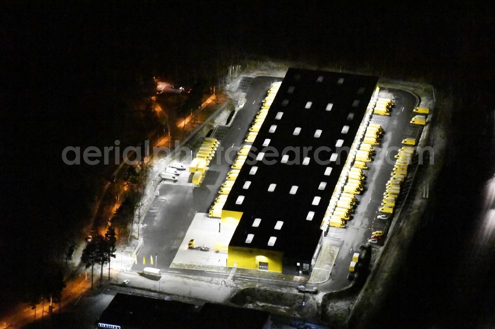 Aerial image at night Kleinmachnow - Night view building complex and distribution center on the site of Deutsche Post AG and DHL Paket GmbH on the Hermann-von-Helmholtz-Strasse in Kleinmachnow in the state Brandenburg