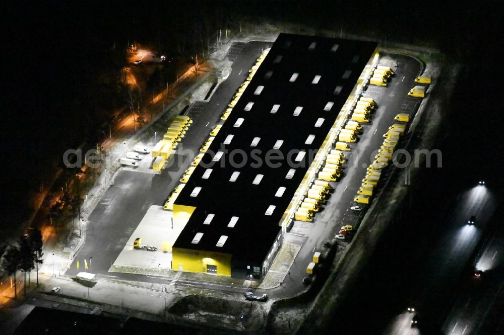 Kleinmachnow at night from above - Night view building complex and distribution center on the site of Deutsche Post AG and DHL Paket GmbH on the Hermann-von-Helmholtz-Strasse in Kleinmachnow in the state Brandenburg