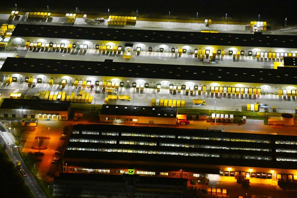 Leipzig at night from above - Night lighting Building complex and distribution center on the site of DHL - Deutsche Post AG on Poststrasse in the district Nordwest in Leipzig in the state Saxony, Germany