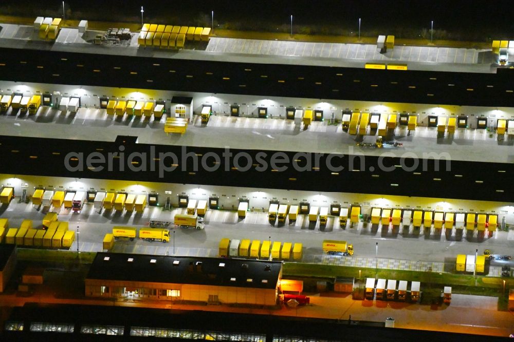 Leipzig at night from the bird perspective: Night lighting Building complex and distribution center on the site of DHL - Deutsche Post AG on Poststrasse in the district Nordwest in Leipzig in the state Saxony, Germany