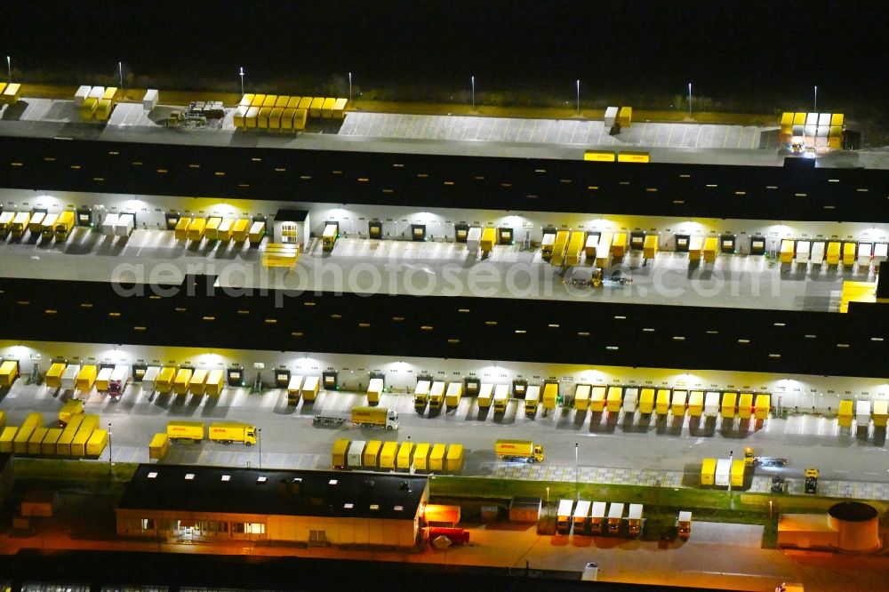 Aerial photograph at night Leipzig - Night lighting Building complex and distribution center on the site of DHL - Deutsche Post AG on Poststrasse in the district Nordwest in Leipzig in the state Saxony, Germany