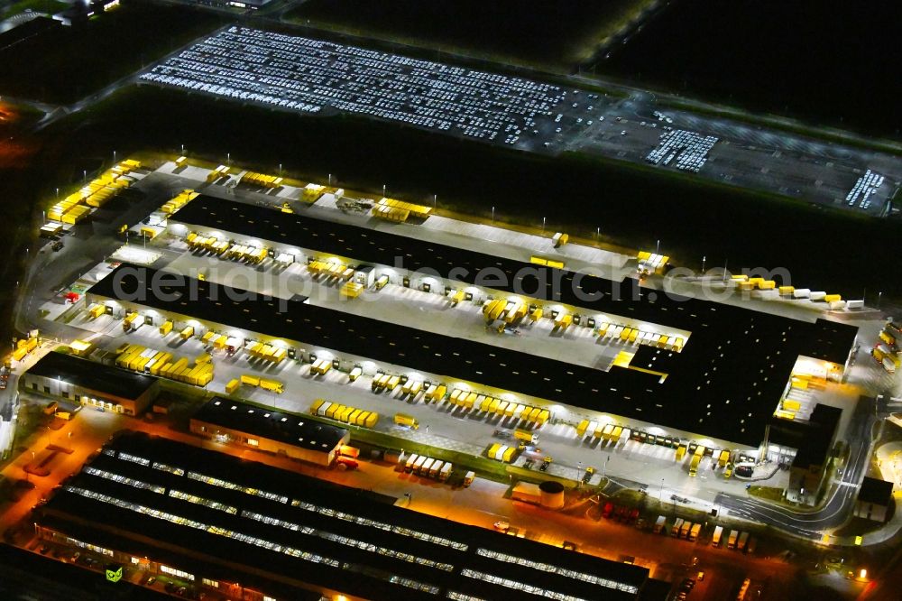 Aerial image at night Leipzig - Night lighting Building complex and distribution center on the site of DHL - Deutsche Post AG on Poststrasse in the district Nordwest in Leipzig in the state Saxony, Germany