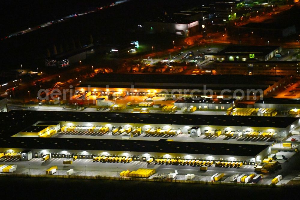 Leipzig at night from above - Night lighting Building complex and distribution center on the site of DHL - Deutsche Post AG on Poststrasse in the district Nordwest in Leipzig in the state Saxony, Germany