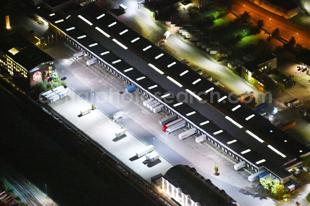 Osnabrück at night from above - Night lighting Building complex and distribution center on the site of Hellmann Worldwide Logistics on Elbestrasse in the district Hafen in Osnabrueck in the state Lower Saxony, Germany