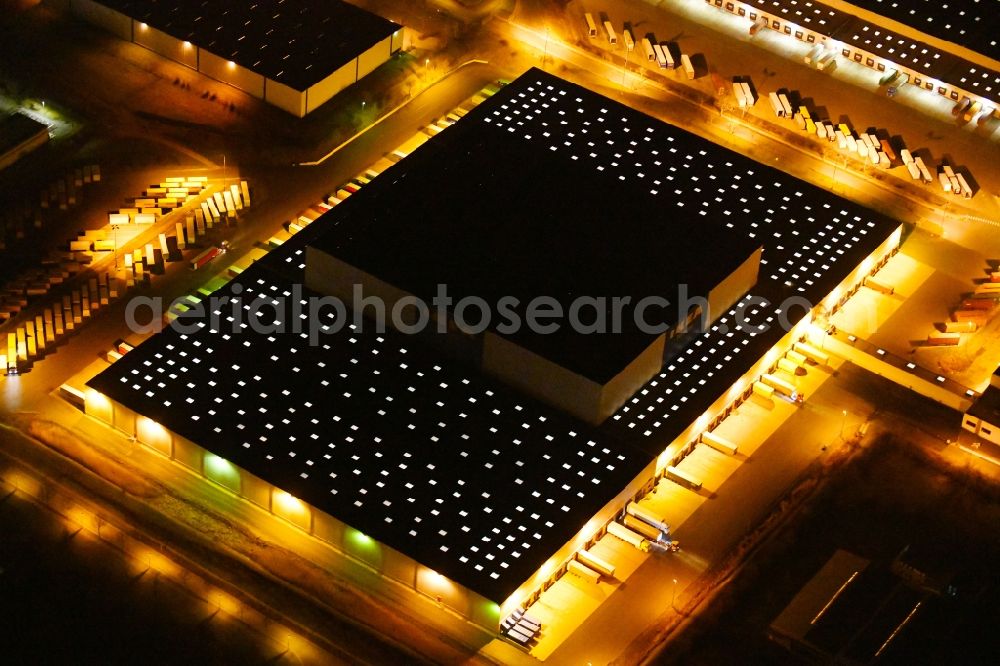 Aerial image at night Erfurt - Night lighting Building complex and distribution center on the site of IKEA Zentrallagers In of Langen Else in the district Buessleben in Erfurt in the state Thuringia, Germany