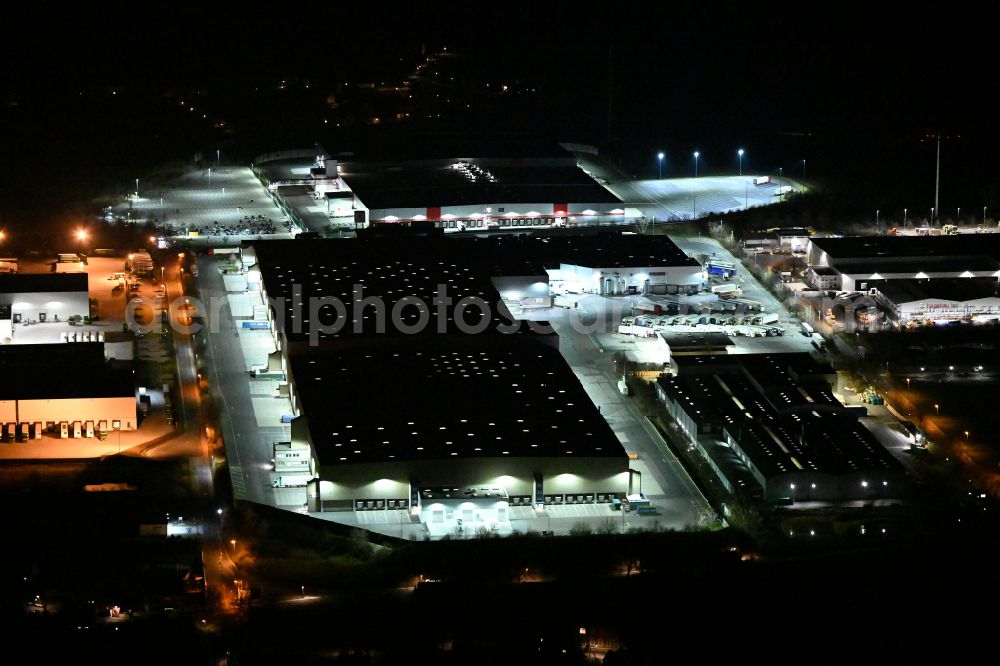 Schleinitz at night from above - Night lighting building complex and distribution center on the site Kaufland Logistik VZ GmbH & Co. KG - Osterfeld on street Kirchweg in Schleinitz in the state Saxony-Anhalt, Germany