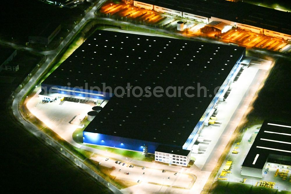 Aerial photograph at night Hörselberg-Hainich - Night lighting building complex and distribution center on the site of Rhenus CL Eisenach GmbH & Co. KG in Hoerselberg-Hainich in the state Thuringia, Germany