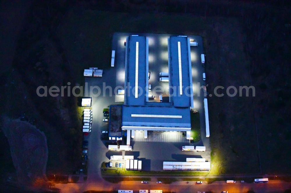 Aerial image at night Bernau - Night lighting building complex and distribution center on the site GLS on Ringstrasse in the district Schoenow in Bernau in the state Brandenburg, Germany