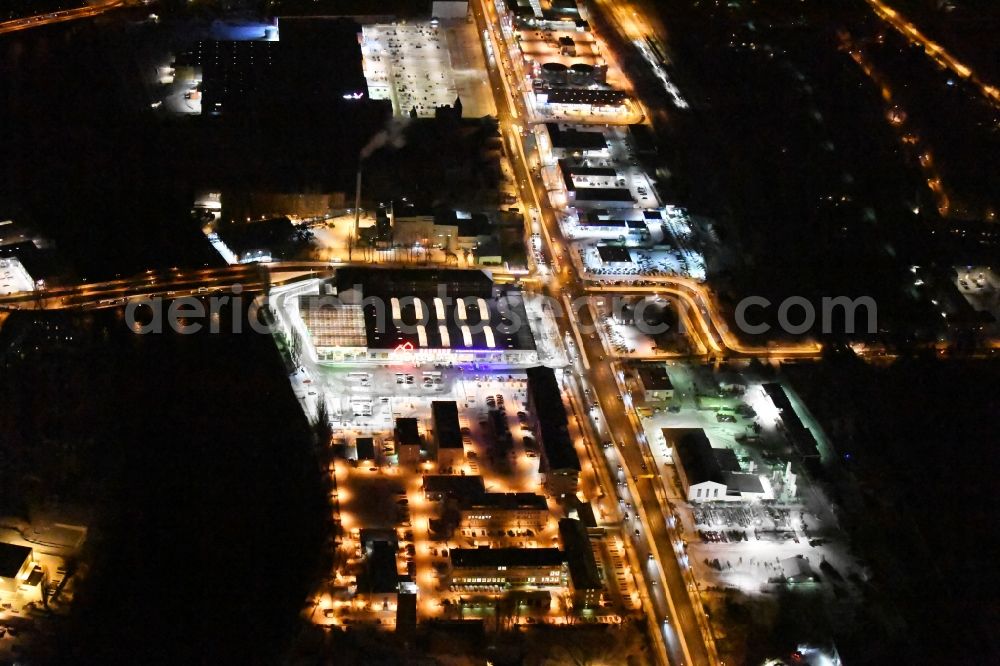 Berlin at night from the bird perspective: Nigt view Building complex of the police Bundespolizeidirektion in the district Niederschoeneweide in Berlin