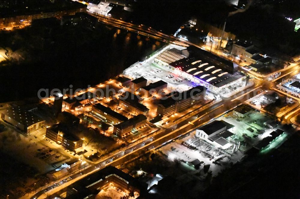 Berlin at night from the bird perspective: Nigt view Building complex of the police Bundespolizeidirektion in the district Niederschoeneweide in Berlin