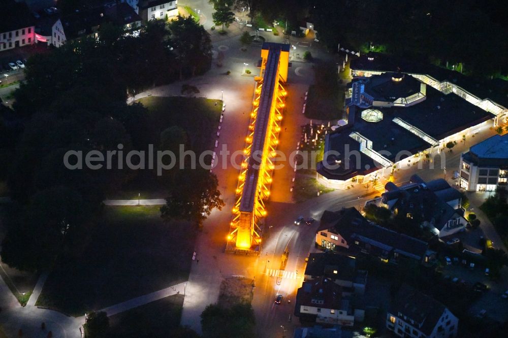 Aerial photograph at night Bad Rothenfelde - Night lighting Industrial monument of the technical plants and salines Altes Gradierwerk in Bad Rothenfelde in the state Lower Saxony, Germany