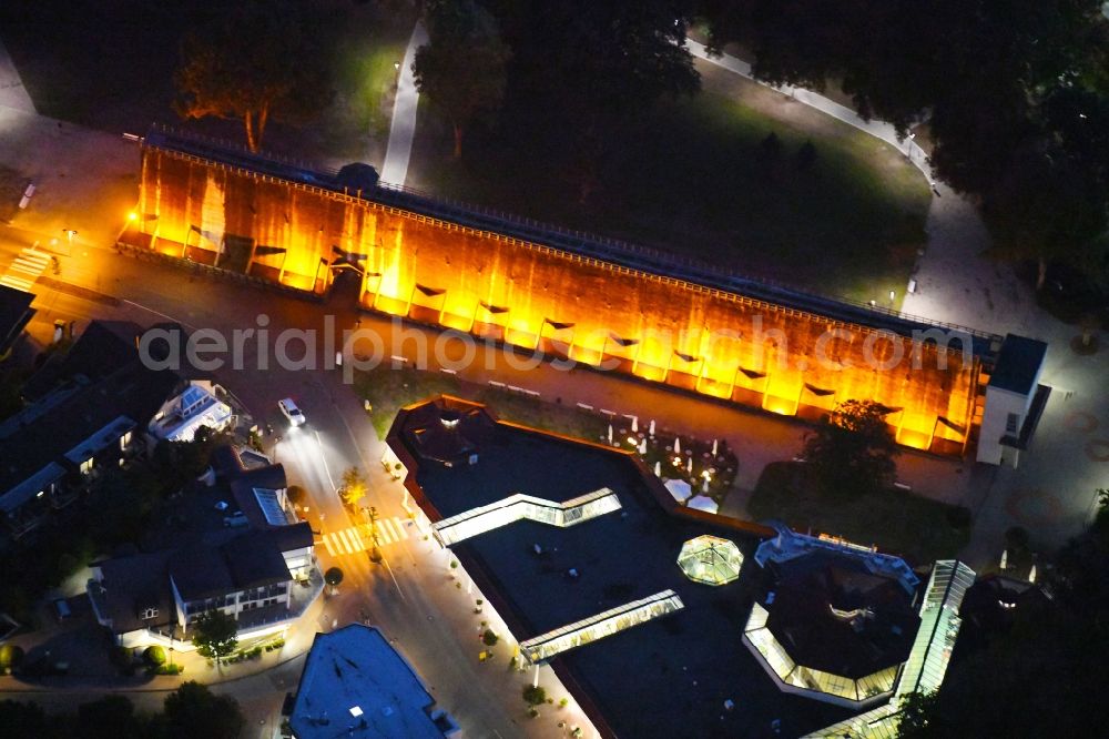 Bad Rothenfelde at night from above - Night lighting Industrial monument of the technical plants and salines Altes Gradierwerk in Bad Rothenfelde in the state Lower Saxony, Germany