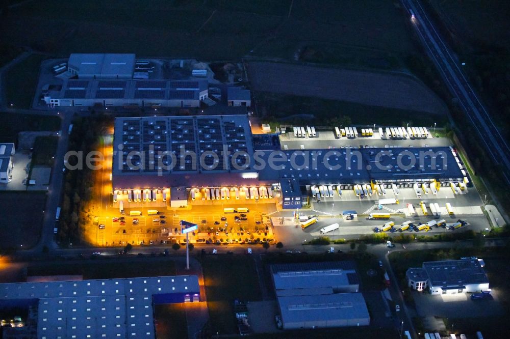 Dissen am Teutoburger Wald at night from the bird perspective: Night lighting Building complex and distribution center on the site of Dachser SE Food Logistics on Konpweg in Dissen am Teutoburger Wald in the state Lower Saxony, Germany