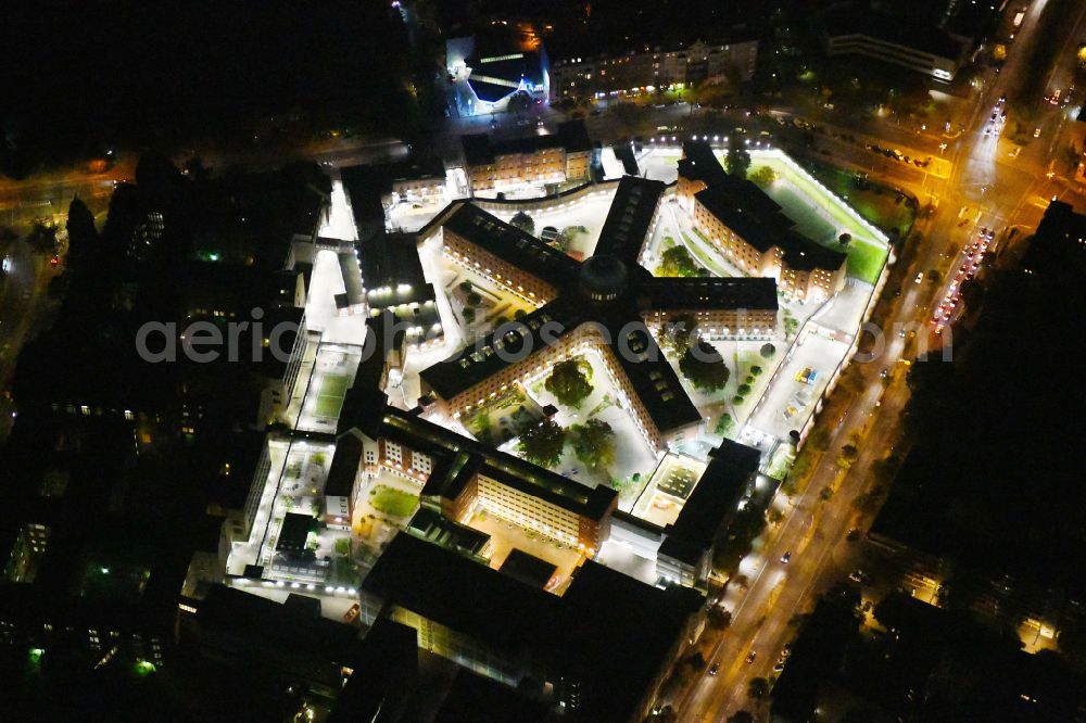 Berlin at night from above - Night lighting Prison grounds and high security fence Prison Berlin-Moabit in Alt-Moabit in the district Moabit in Berlin, Germany