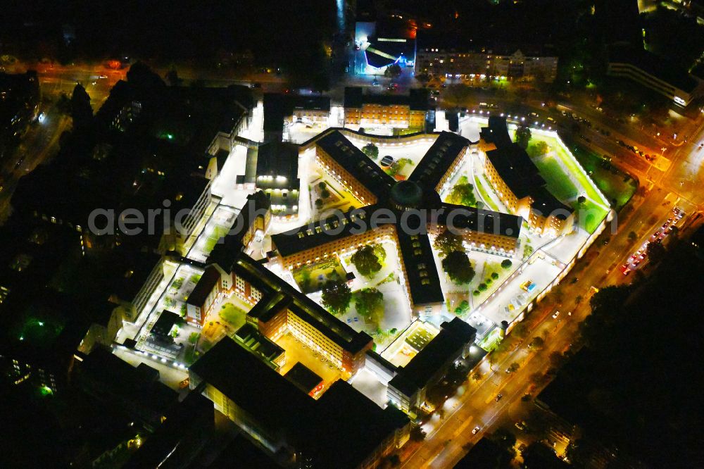 Aerial photograph at night Berlin - Night lighting Prison grounds and high security fence Prison Berlin-Moabit in Alt-Moabit in the district Moabit in Berlin, Germany