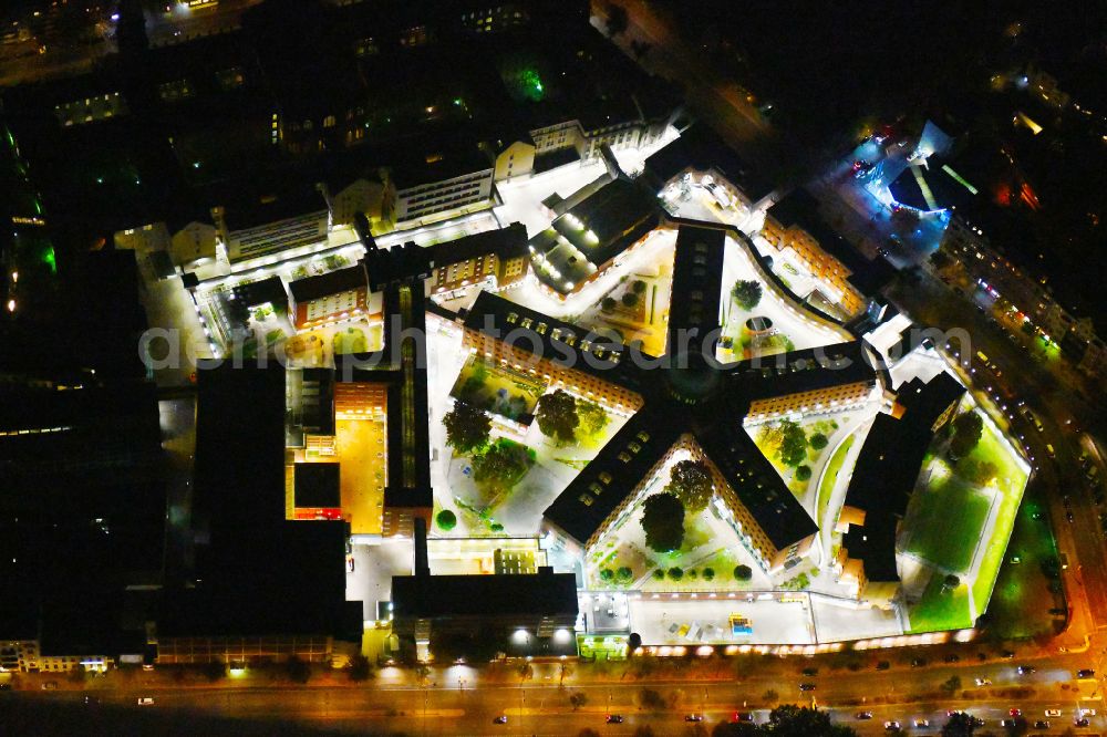 Aerial image at night Berlin - Night lighting Prison grounds and high security fence Prison Berlin-Moabit in Alt-Moabit in the district Moabit in Berlin, Germany